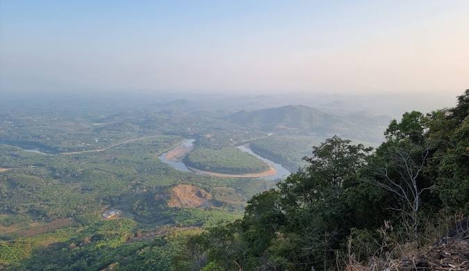 Scenic view of Nilambur town in Malappuram district surrounded by greenery and popular restaurants in Nilambur.
